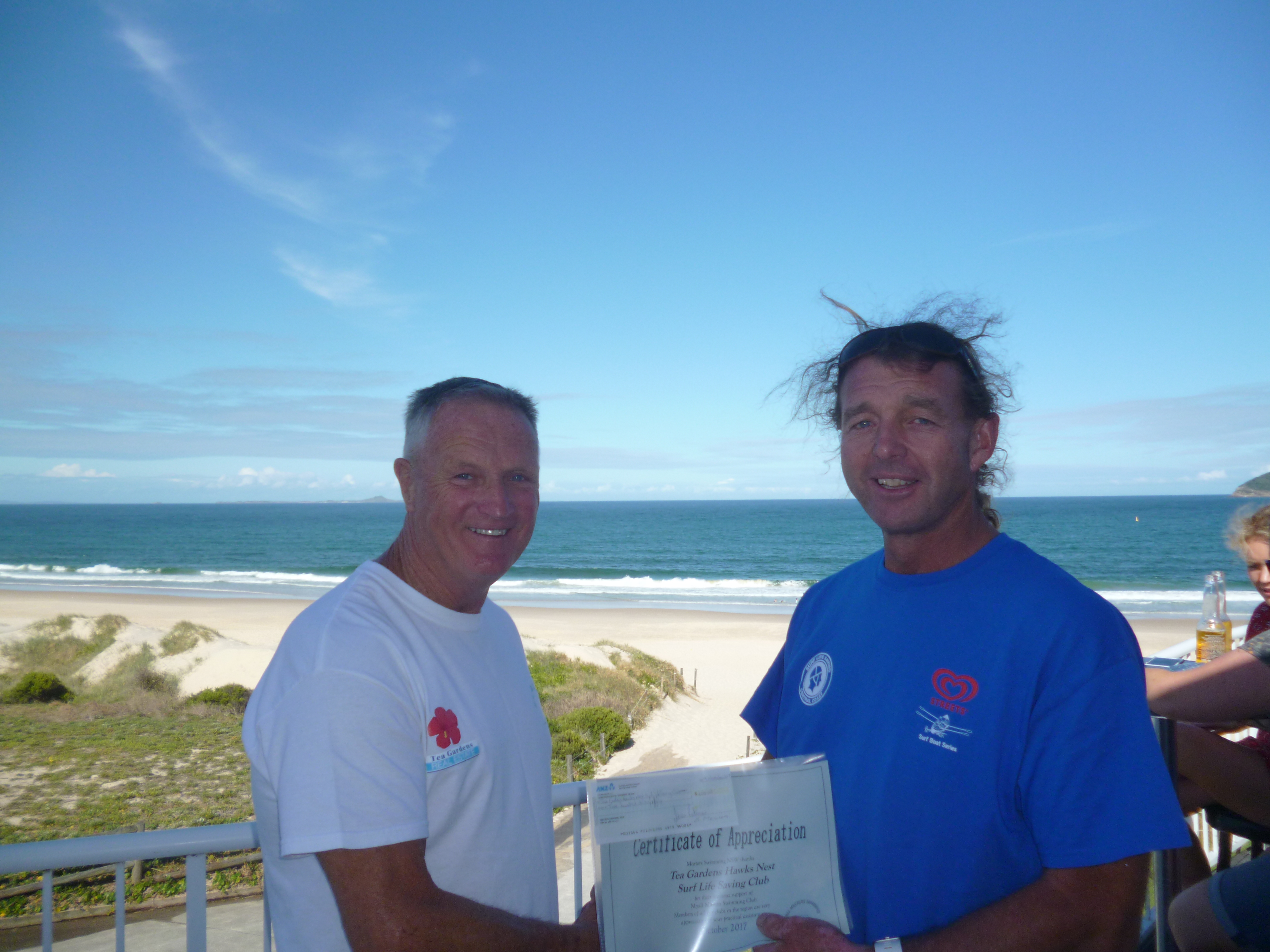 Mobbsy presents Cheque and certificate of appreciation to President of Tea Gardens Hawks Nest SLSC